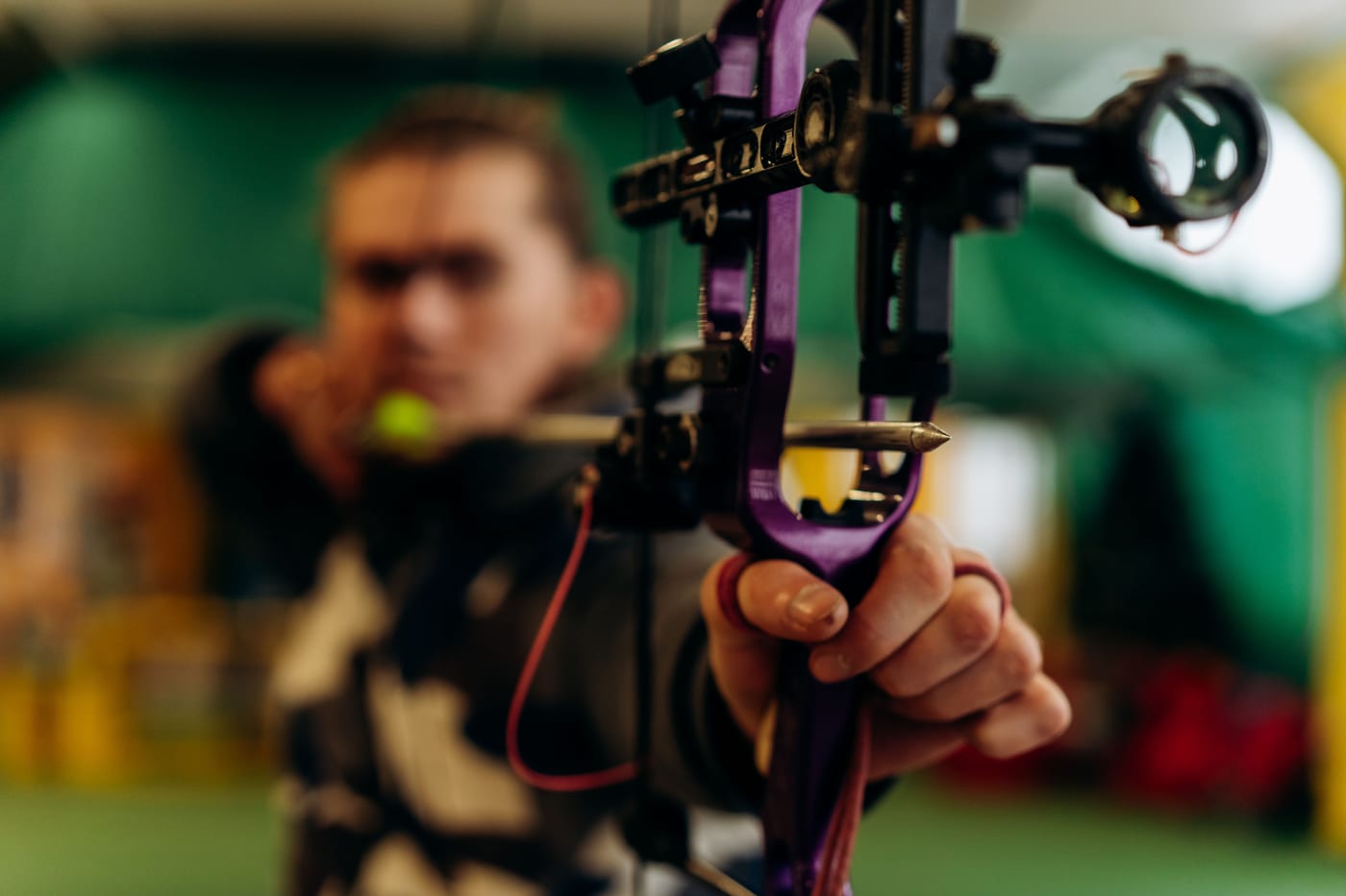 Archer at full draw, eyes locked on the target